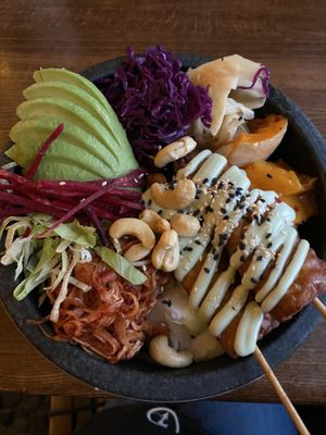 Yummy vegan bowl with Tempeh, pumpkin and kimchii  at Secret Garden in Berlin