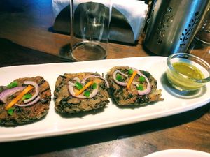 “Cheesy” spinach patties. Yum! at Vegan Zeals in Pondicherry