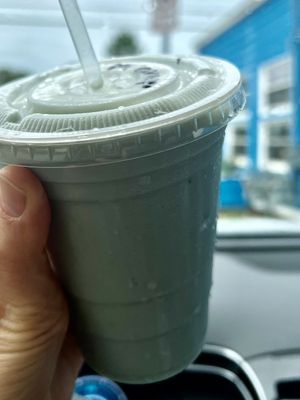 Blue spirulina smoothie with almond milk and  mango   at Zeke's Beans & Bowls in Norfolk