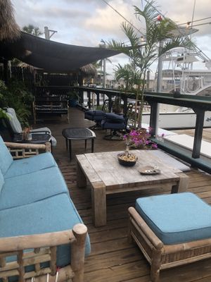 Outdoor seating with view of harbor   at Mellow Cafe in Key West