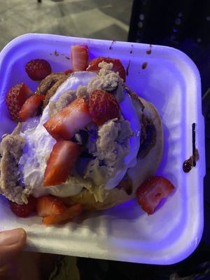 roll with cream cheese frosting, cookie dough, and strawberries  at Cinnaholic in Seattle
