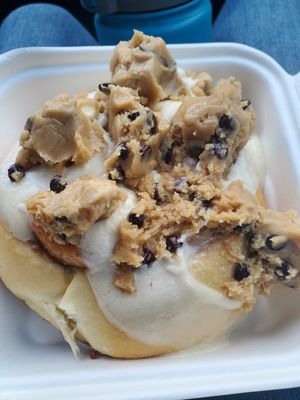 Roll with cream cheese frosting and cookie dough. The employee put on gloves to pull the dough apart. I suggest they invest in a scoop . at Cinnaholic in Seattle