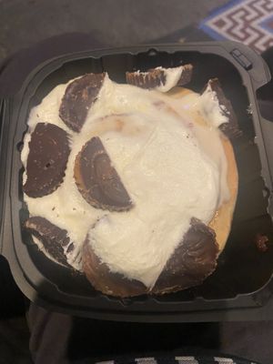 DIY roll with cream cheese frosting and Peanut Butter Cups  at Cinnaholic in Seattle