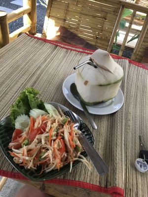 Papaya salad and fresh coconut  at Vegan Phangan in Koh Phangan
