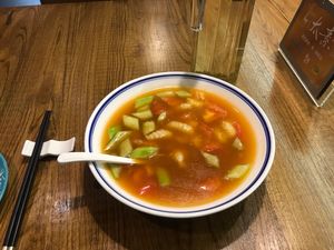 Tomato, cucumber, and some kind of pasta in tomato soup  at TàiSù ShūShí in Shanghai