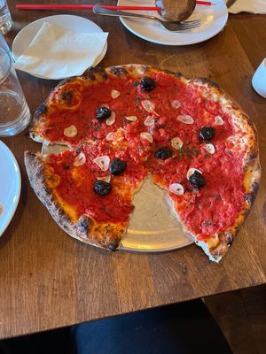 Rosso pizza with olives  at Kokeshi in Salem