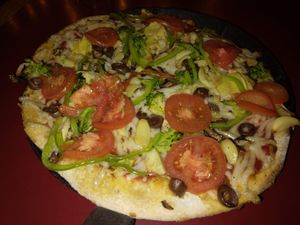 Veggie Delight small pizza with whole wheat vegan crust and vegan cheese at Mooses Tooth in Anchorage