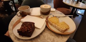 Latte coconut milk, cake with lemon glaze and pecan brownie at Vertigo - Cross St in Manchester
