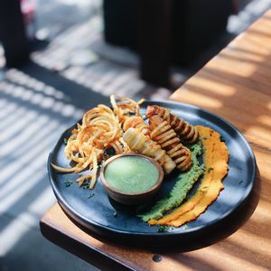 We called this dish vegetables bundles - it is mixed vegetables (carrots, zucchini, celery, eggplant) and tofu wrapped in crispy potatoes. Special thanks to our favorite vegan chef at Manggis in Canggu in Canggu