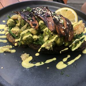 Avocado toast with king oyster mushrooms  at Manggis in Canggu in Canggu