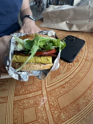 Vegan breakfast sandwich on plain bagel   at Forage Market in Portland