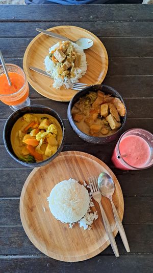 Red (right bowl) + green curry at Benny's On The Beach in Koh Lipe