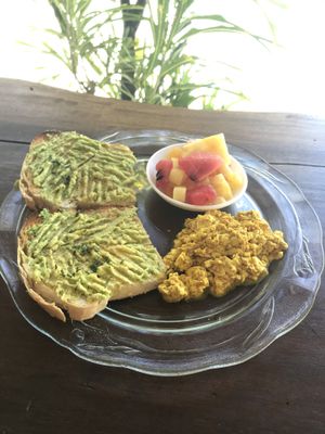 Avacado toast on homemade vegan bread and seasonal fruits!  at The Hangover in Puerto Viejo De Talamanca