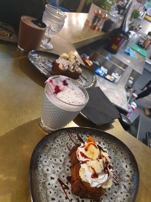 Banana bread with hot chocolate and blue butterfly pea latte at Redemption - Seven Dials in London