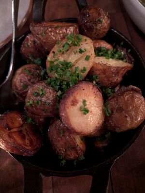 Crispy potatoes, chives at Three Blue Ducks in Ewingsdale