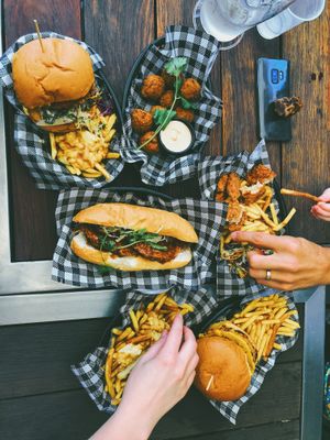 Burgers/long roll/fries at MURDEReats in Leichhardt