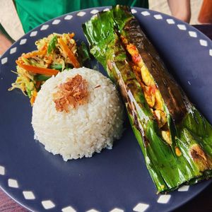 Tofu cooked in banana leaf with Balinese spices, rice and veg  at Clasico in Lembongan