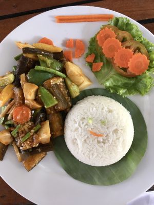 Stir fried eggplant with rice (the owner’s daughter added a smiley face to the rice)  at Bar Ang in Battambang