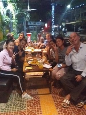 Monday madness at Bar Ang with a nice mix of tourists and locals eating vegan prepared Khmei specialty dishes for wedding party. at Bar Ang in Battambang