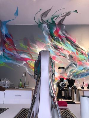 Coffee machine and Hummingbird on the wall. at Hummingbird in Amsterdam