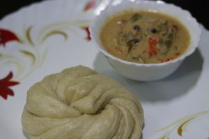 Bhutanese "Ema Datshi" with steamed bun "Tingmo" at Cafe VegaNation in Siliguri