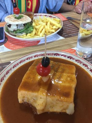 Vegan francesinha (and vegan burger in the background)! Very tasty  traditional dish😋 at Santa Francesinha in Porto