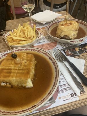 Vegan franceshina on the left  at Santa Francesinha in Porto