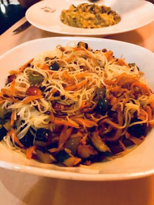 Tasty wok fried rice noodles with fresh ginger & veggies  at Madre Tierra in Toledo