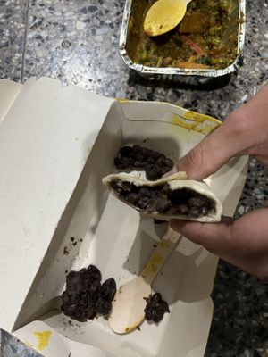 This is what they call “bean fajita”. Self note: always open the take away boxes before leaving restaurants to check what you are being served.  at Kormasutra in Cusco