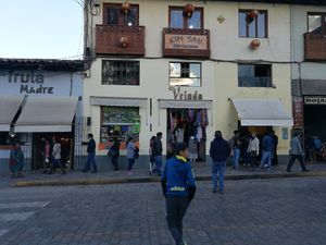 Window of snacks next to a Vrinda store. at Vegetarian Snack in Cusco
