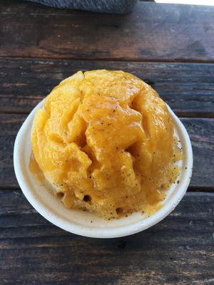 Soursop and passion fruit ice with passion fruit butter on top (vegetarian)  at Kula Shave Ice in Hilo