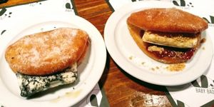 Dessert donut bao with black sesame ice-cream (left) and peanut butter ice-cream and jam at Baby Bao in South West London