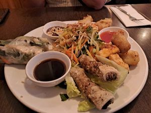 Vegan sharing platter. Battered silken tofu. Vegan fish cakes. Summer rolls. Veg spring rolls. Soy sauce and fresh salad all with satay sauce and sweet chilli sauce. at Sen Viet in London