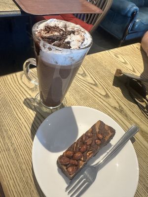 Oat hot chocolate with vegan whip and a vegan peanut butter brownie   at Suzie's Cup of Joy in Cleethorpes