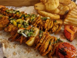 Chicken skewer at Hummus Bar in Haifa