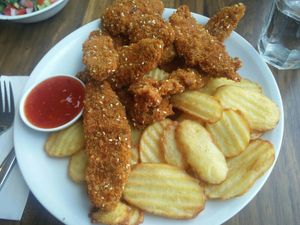 Shnitzelonim and fries at Hummus Bar in Haifa