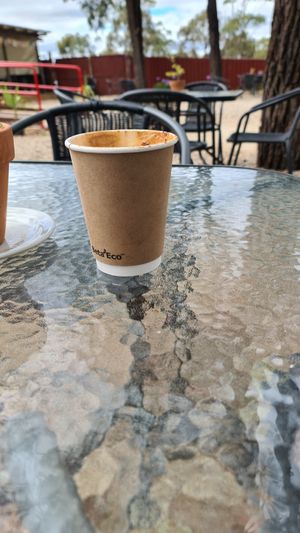 Medium coffee, peaceful outdoor seating at StupaView Cafe in Myers Flat