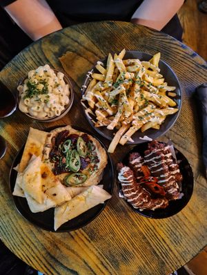Mac N Chz (top left) garlic butter fries (top right) winter hummus & flatbread (bottom left) Kentucky wings Korean BBQ flavour (bottom right) at BA-HA in Birmingham