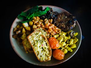 Brunch of Champions

Homemade Sausage patty, scramble, cheese Loaf slices, beans, tomatoes, Spinach, mushrooms, onions and garlic and Herb parmentier. 

 at BA-HA in Birmingham