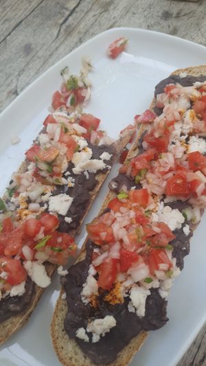 Vegan molletes with almond cheese at Orgánico in Merida
