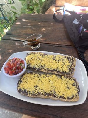 Bread with beans and vegan cheese, and pico de gallo on the side.  at Orgánico in Merida