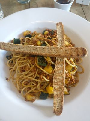 Pasta with vegan chorizo, vegetables and pumpkin seeds integral bread at Orgánico in Merida