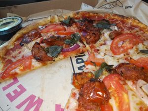 Onion, tomatoes, basil, garlic, sun dried tomatoes, vegan cheese at Rapid Fired Pizza in Spartanburg