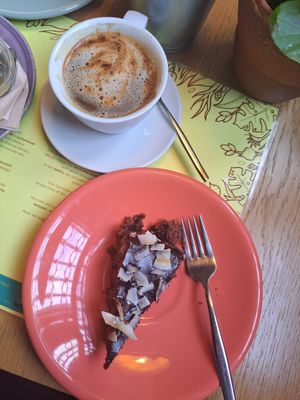 Cacao cake with cappuccino at Semente - Art - Coffee & Plant Based Food in Braga