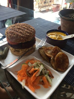Vegan burger, with veg, potato chip and soup at Travel Yoga Cafe in New Delhi
