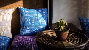 Our interior, with handmade cushions by Safomasi  at Travel Yoga Cafe in New Delhi