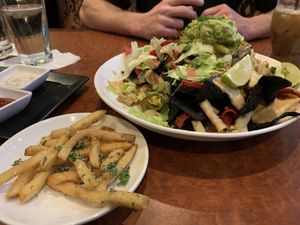 Vegan nachos and truffle fries at CRAVE in Maple Grove