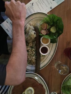 Vegan bratwurst as long as my forearm. Dumplings on the side with sauerkraut, veggies and two delicious sauces. at Hinterhof in Los Angeles