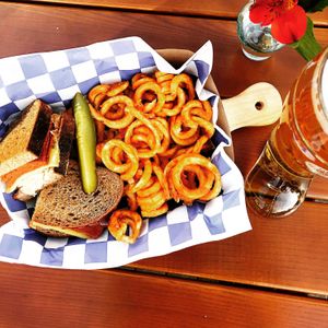 The Reuben - vegan corned beef, melted Swiss, sauerkraut and Russian dressing on toasted German rye. Served with curly fries  at Hinterhof in Los Angeles
