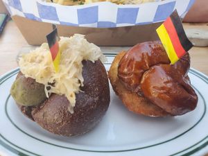 Brat slider on rye bread with sauerkraut and a schnitzel slider with lingonberry mayo on a pretzel bun! at Hinterhof in Los Angeles